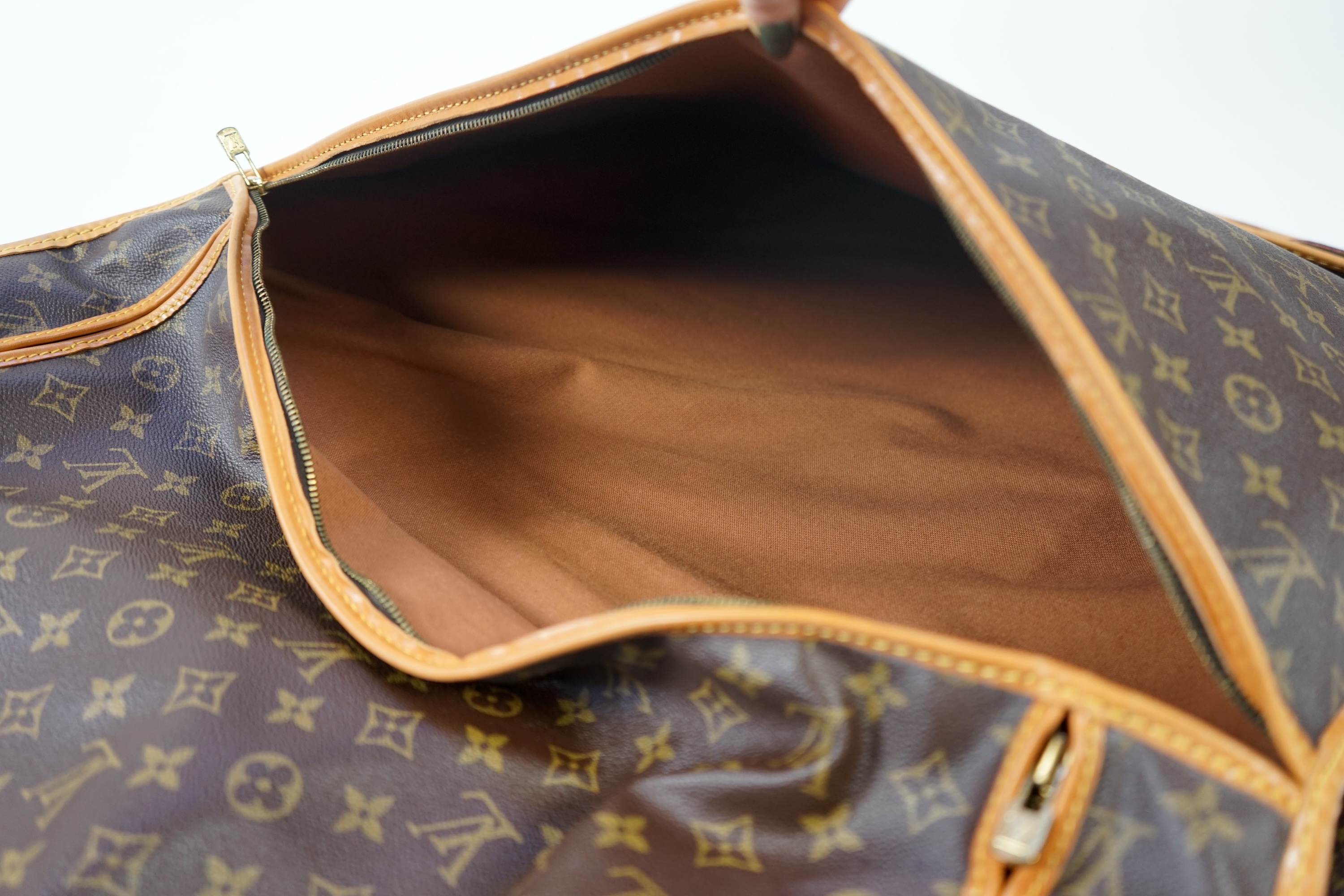 A Louis Vuitton monogram canvas and leather travel bag, 60cm x 53cm x 20cm closed